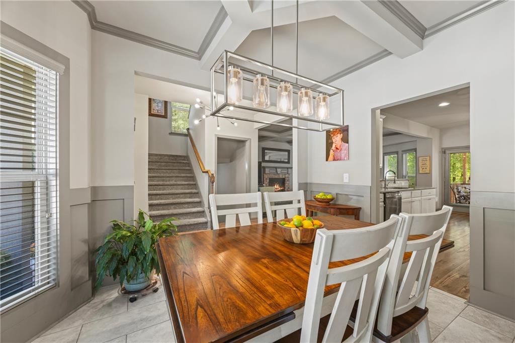 816 Mimosa Way Jefferson, GA 30549 - Photo 20 of 83 a dining room with furniture potted plants and wooden floor