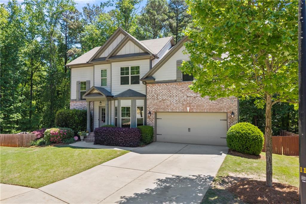 816 Mimosa Way Jefferson, GA 30549 - Photo 2 of 83 a front view of a house with a garden