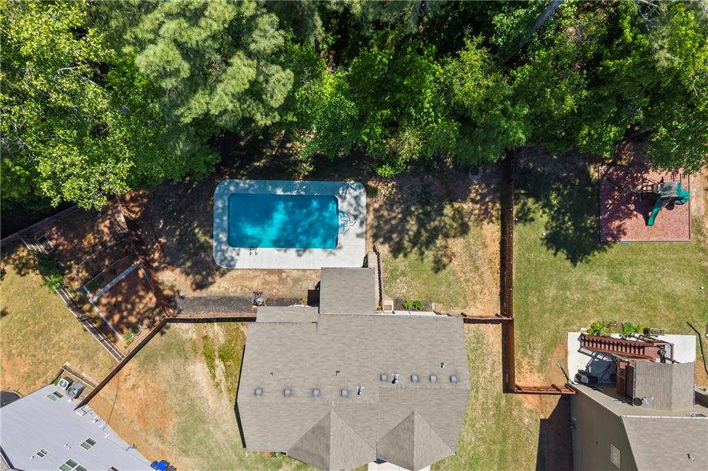 816 Mimosa Way Jefferson, GA 30549 - Photo 25 of 30 an outdoor view with swimming pool and green space