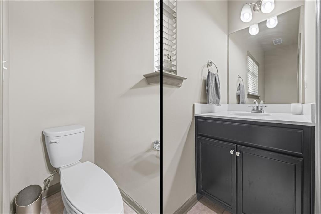816 Mimosa Way Jefferson, GA 30549 - Photo 32 of 83 a bathroom with a toilet sink and mirror