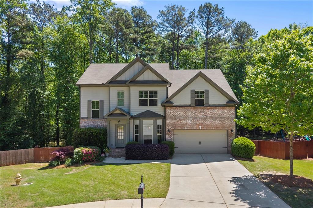 816 Mimosa Way Jefferson, GA 30549 - Photo 4 of 83 a front view of a house with a yard and garage