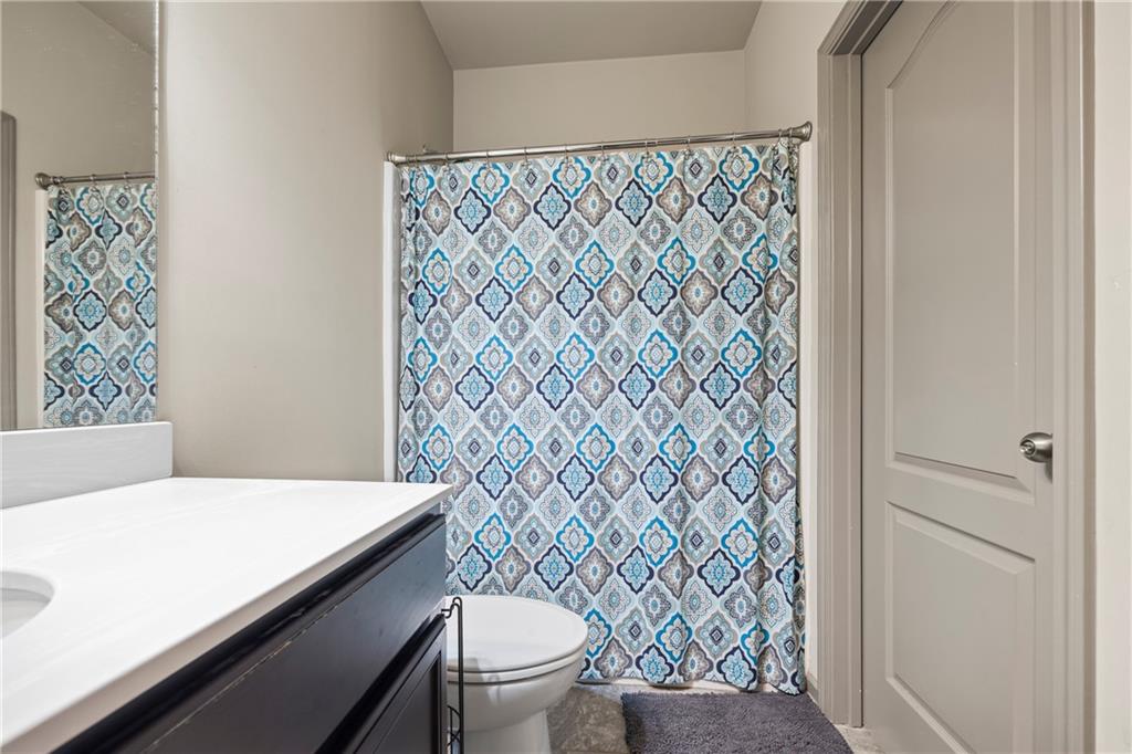 816 Mimosa Way Jefferson, GA 30549 - Photo 50 of 83 a bathroom with a toilet and a shower curtain