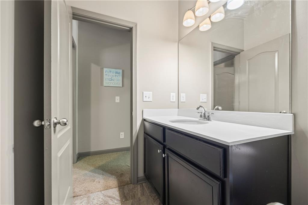 816 Mimosa Way Jefferson, GA 30549 - Photo 51 of 83 a bathroom with a sink and a mirror