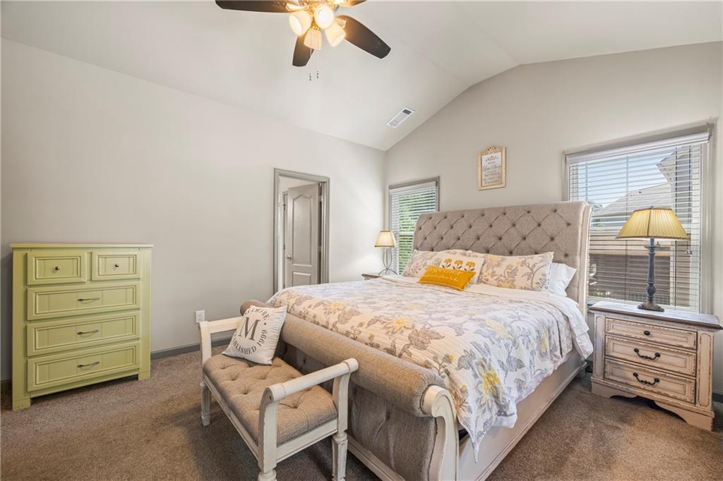 816 Mimosa Way Jefferson, GA 30549 - Photo 57 of 83 a bedroom with a bed and a chandelier
