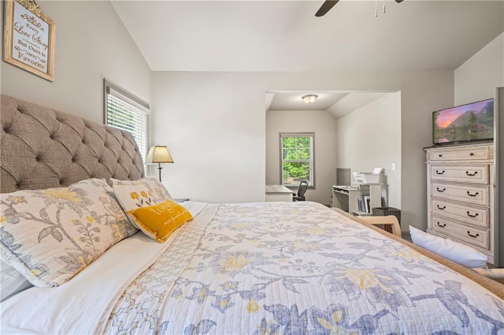 816 Mimosa Way Jefferson, GA 30549 - Photo 58 of 83 a bedroom with a bed and a television