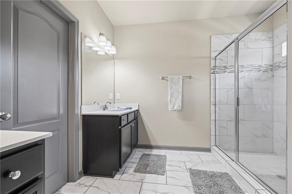 816 Mimosa Way Jefferson, GA 30549 - Photo 61 of 83 a bathroom with a sink a toilet and shower