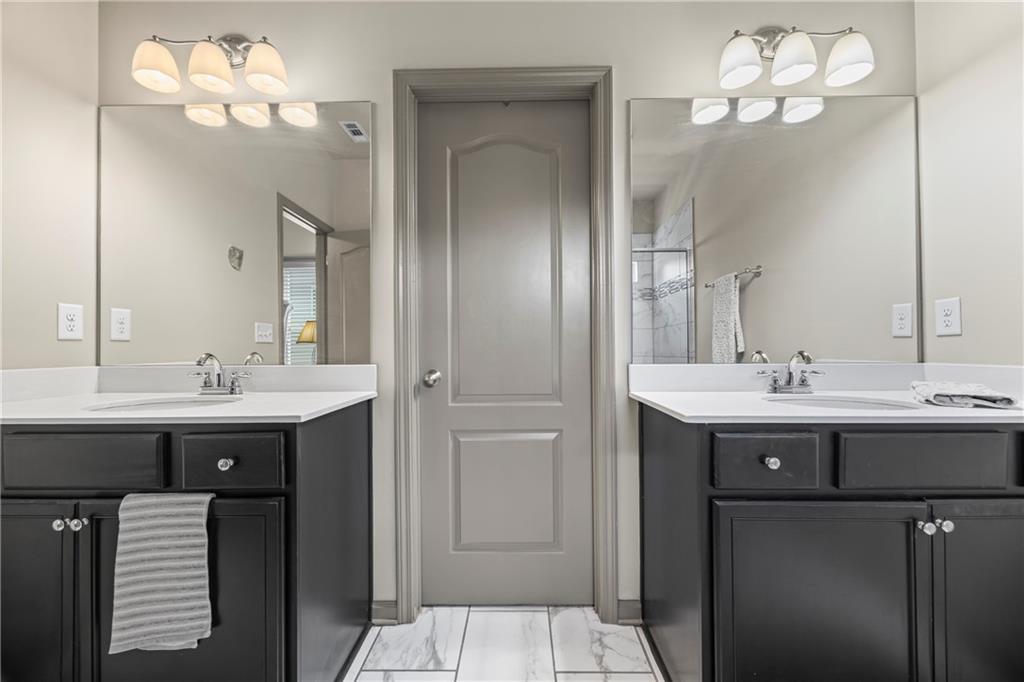 816 Mimosa Way Jefferson, GA 30549 - Photo 62 of 83 a bathroom with a sink and a mirror