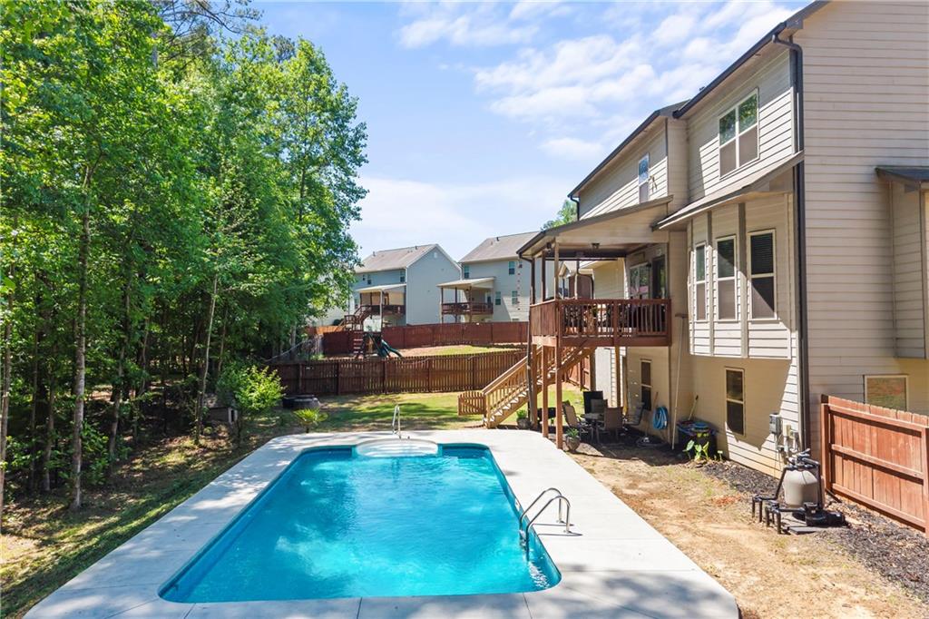 816 Mimosa Way Jefferson, GA 30549 - Photo 67 of 83 a view of a patio with table and chairs near a yard