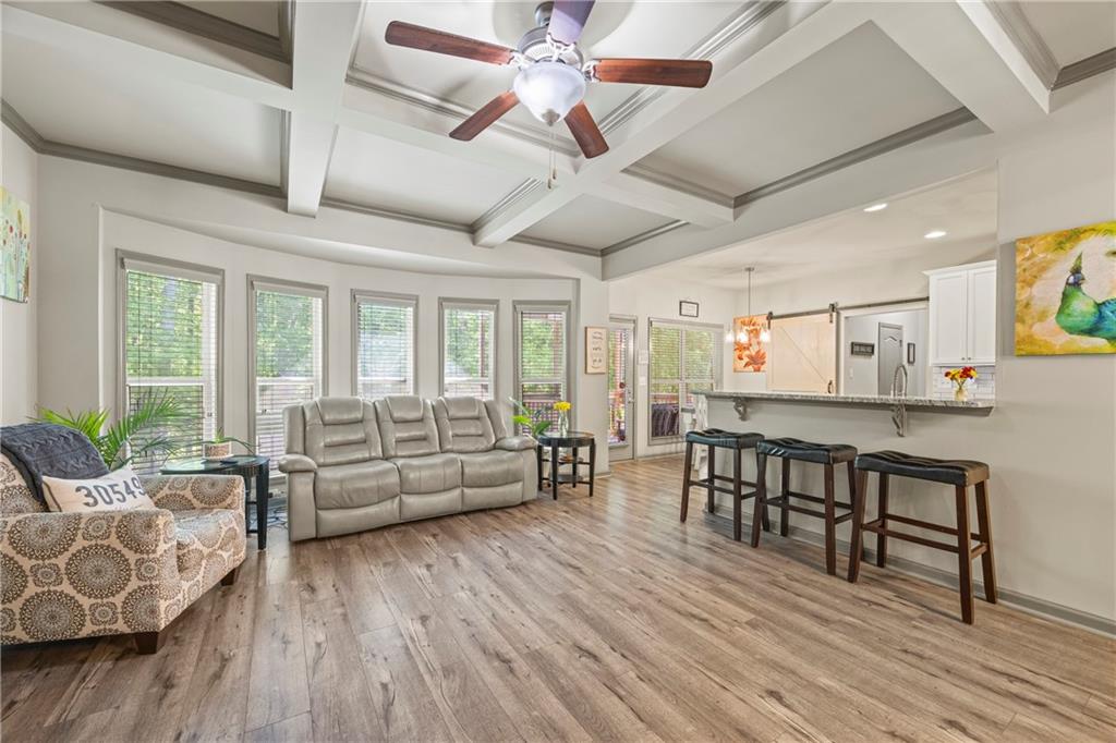 816 Mimosa Way Jefferson, GA 30549 - Photo 9 of 30 a living room with furniture and a wooden floor