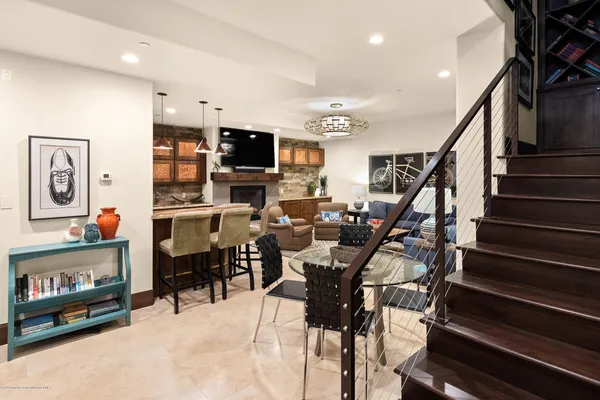 a view of a livingroom with furniture and a flat screen tv
