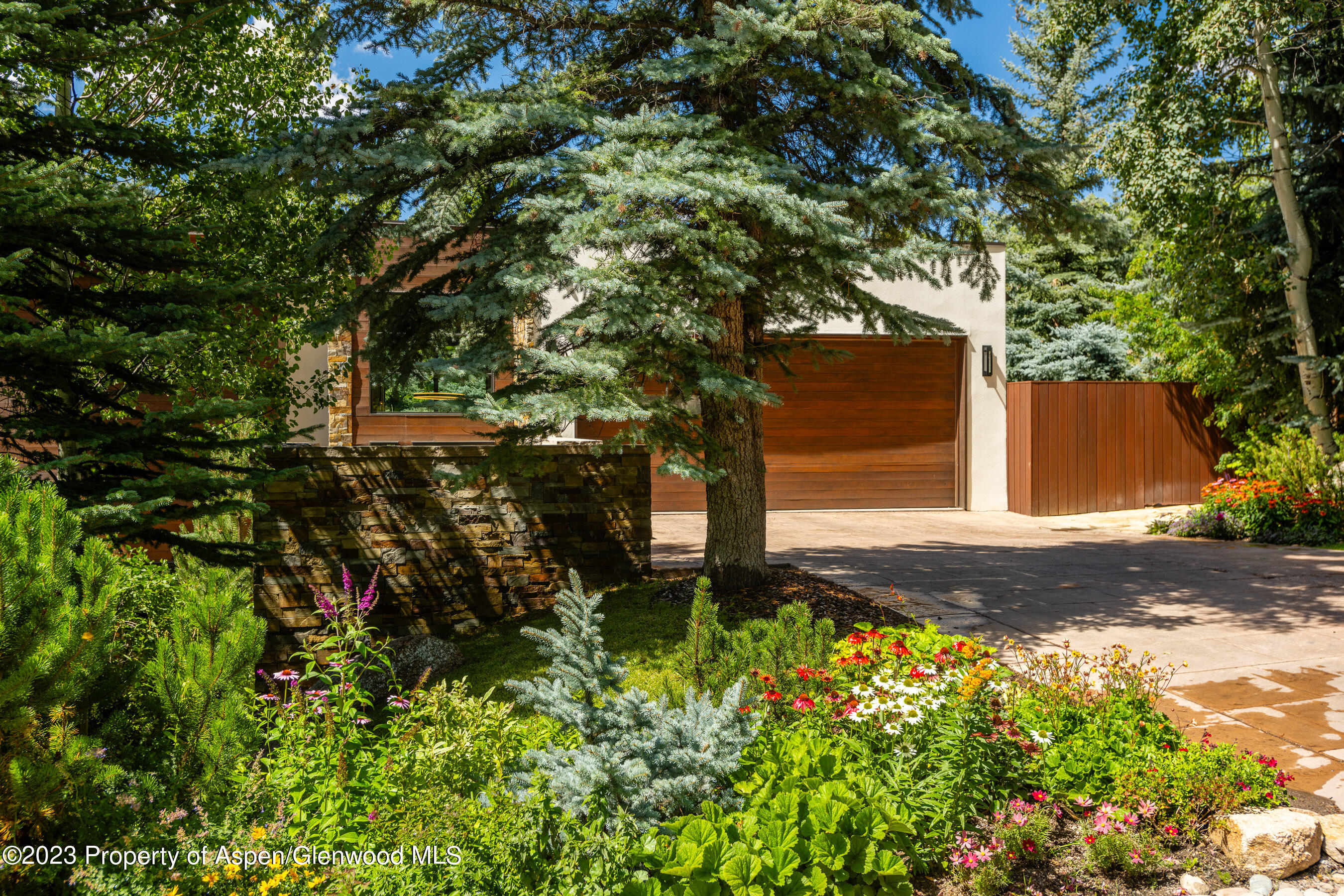 138 West Lupine Drive Aspen, CO 81611 - Photo 23 of 24 a backyard of a house with lots of green space