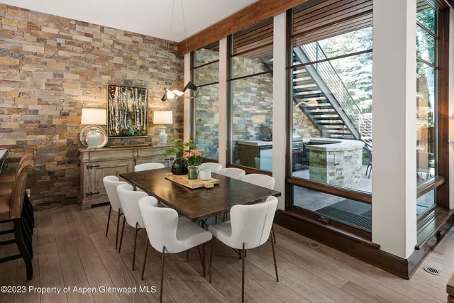 a view of a dining room with furniture window and outside view