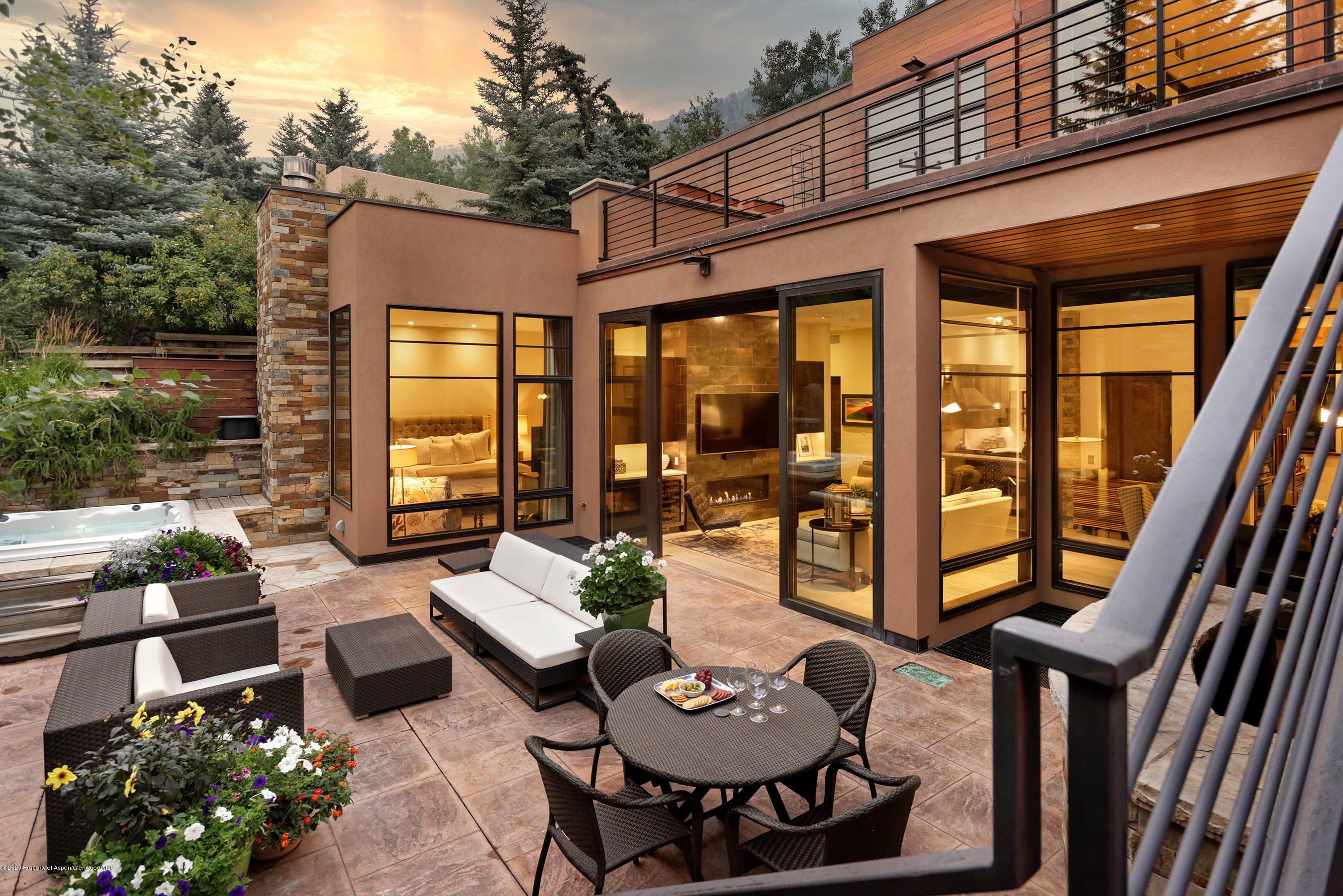 138 West Lupine Drive Aspen, CO 81611 - Photo 4 of 24 a view of a patio with couches table and chairs and potted plants