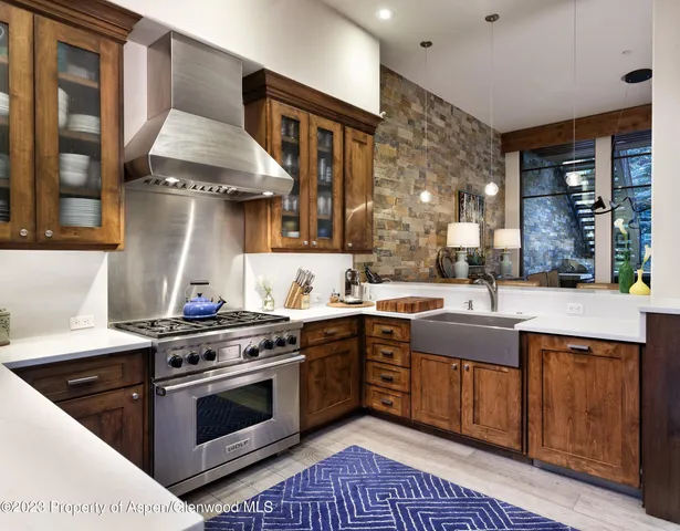a kitchen with a stove and a sink