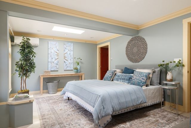 a bedroom with a bed and a fireplace