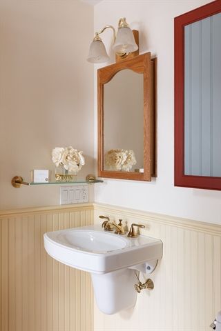 a bathroom with a sink and mirror