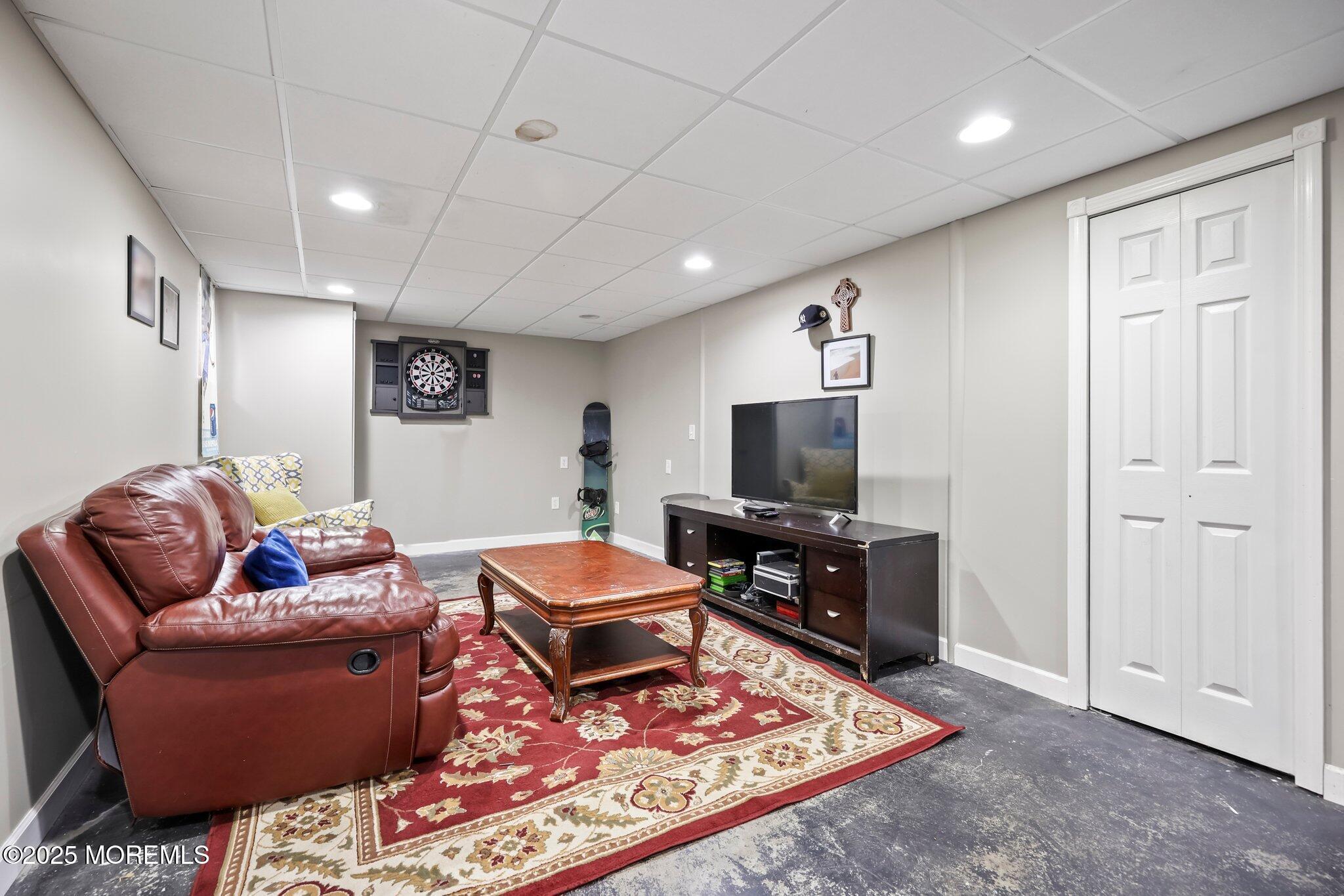 2 Independence Drive Aberdeen, NJ 07747 - Photo 21 of 43 a living room with furniture and a flat screen tv