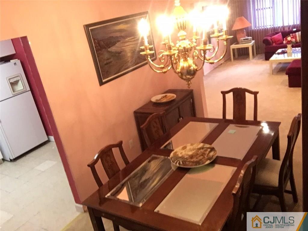 6804 Hana Road Edison, NJ 08817 - Photo 8 of 25 a view of a dining room with furniture