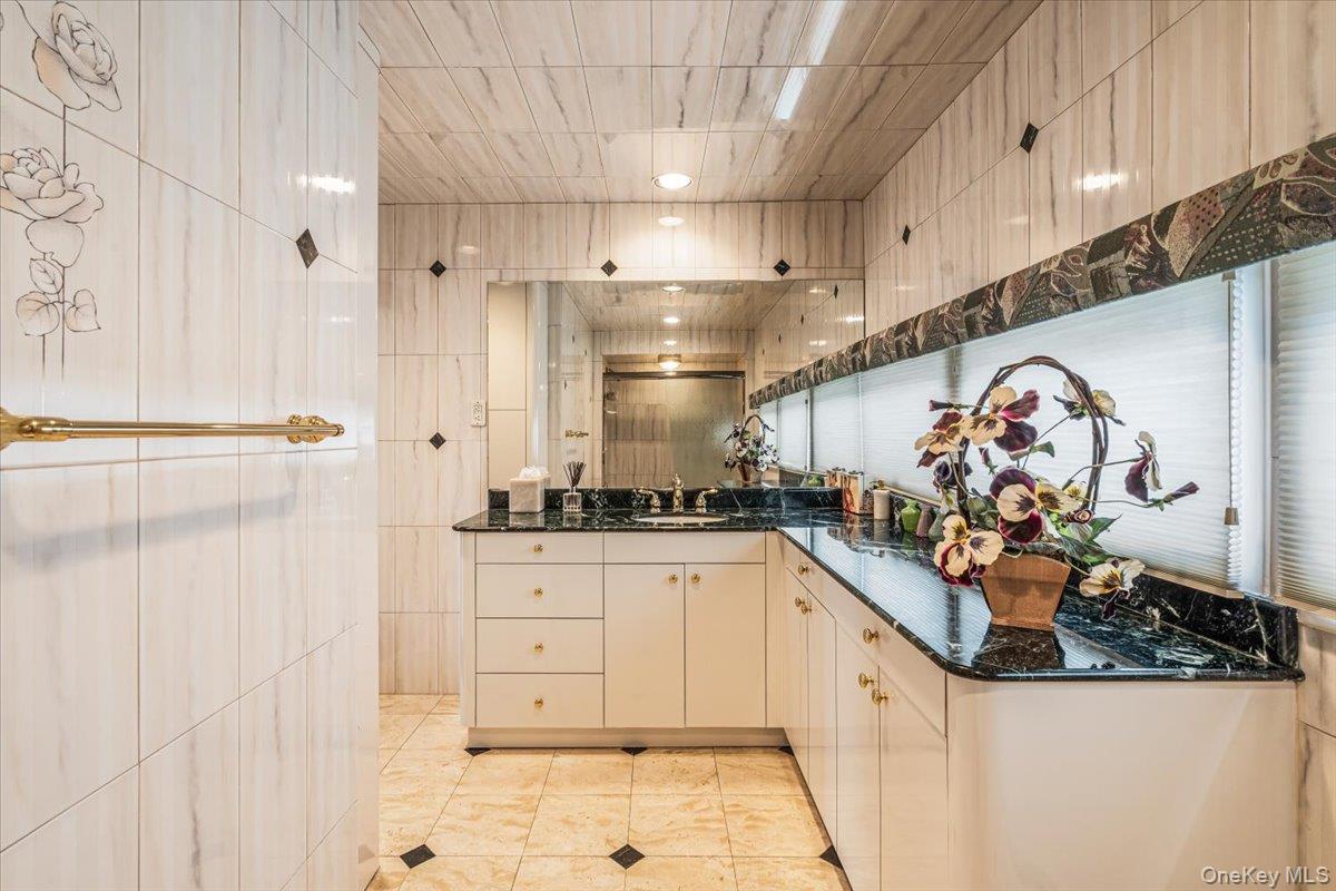 154-43 Riverside Drive Queens, NY 11357 - Photo 25 of 41 a kitchen with stainless steel appliances granite countertop a sink and a stove