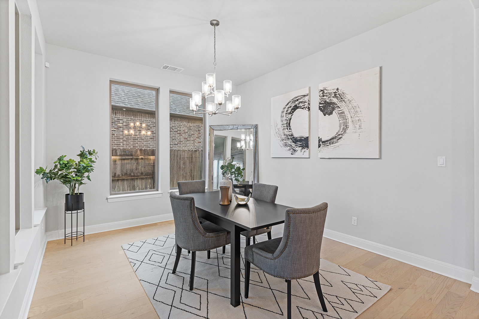 105 Bull Rdg Trail Georgetown, TX 78628 - Photo 13 of 36 a dining room with furniture a painting and a chandelier