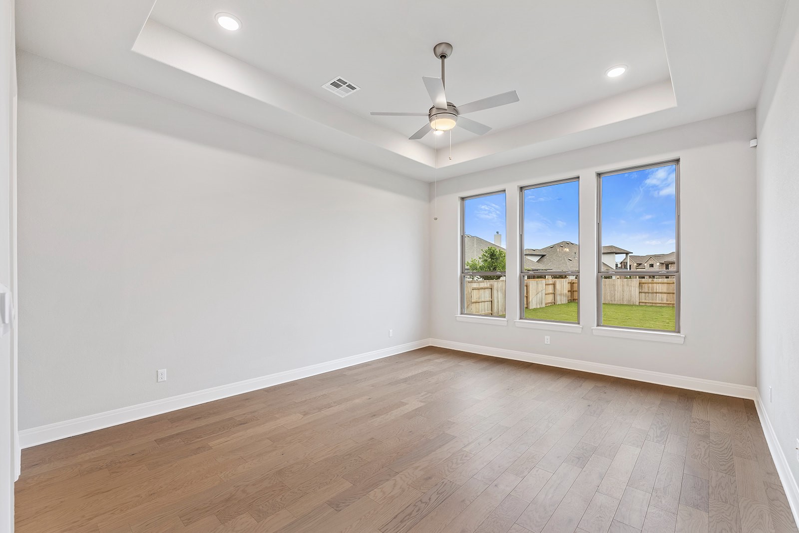 105 Bull Rdg Trail Georgetown, TX 78628 - Photo 20 of 36 an empty room with wooden floor and windows