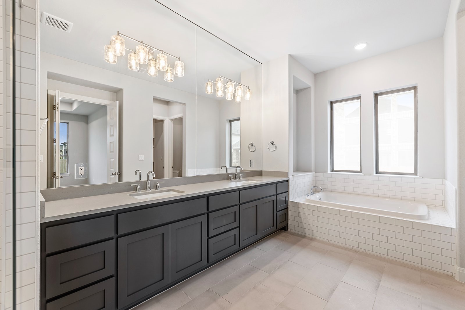 105 Bull Rdg Trail Georgetown, TX 78628 - Photo 22 of 36 a large bathroom with a large tub sink and mirror