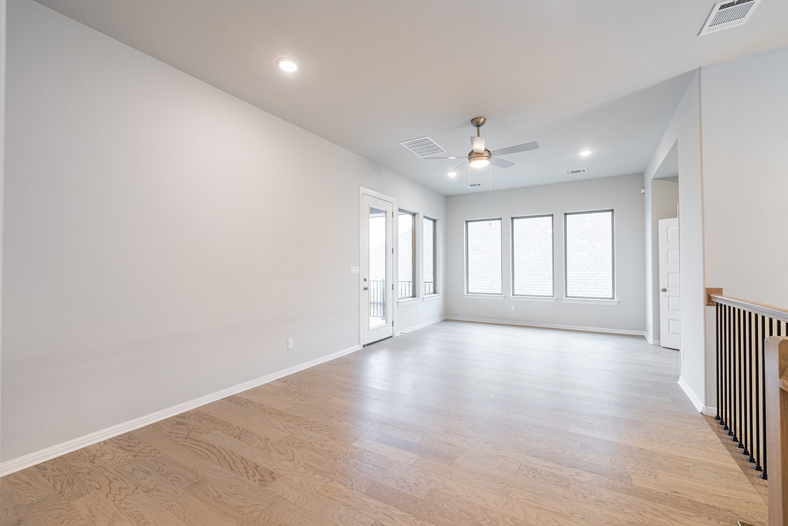 105 Bull Rdg Trail Georgetown, TX 78628 - Photo 24 of 36 an empty room with wooden floor and windows
