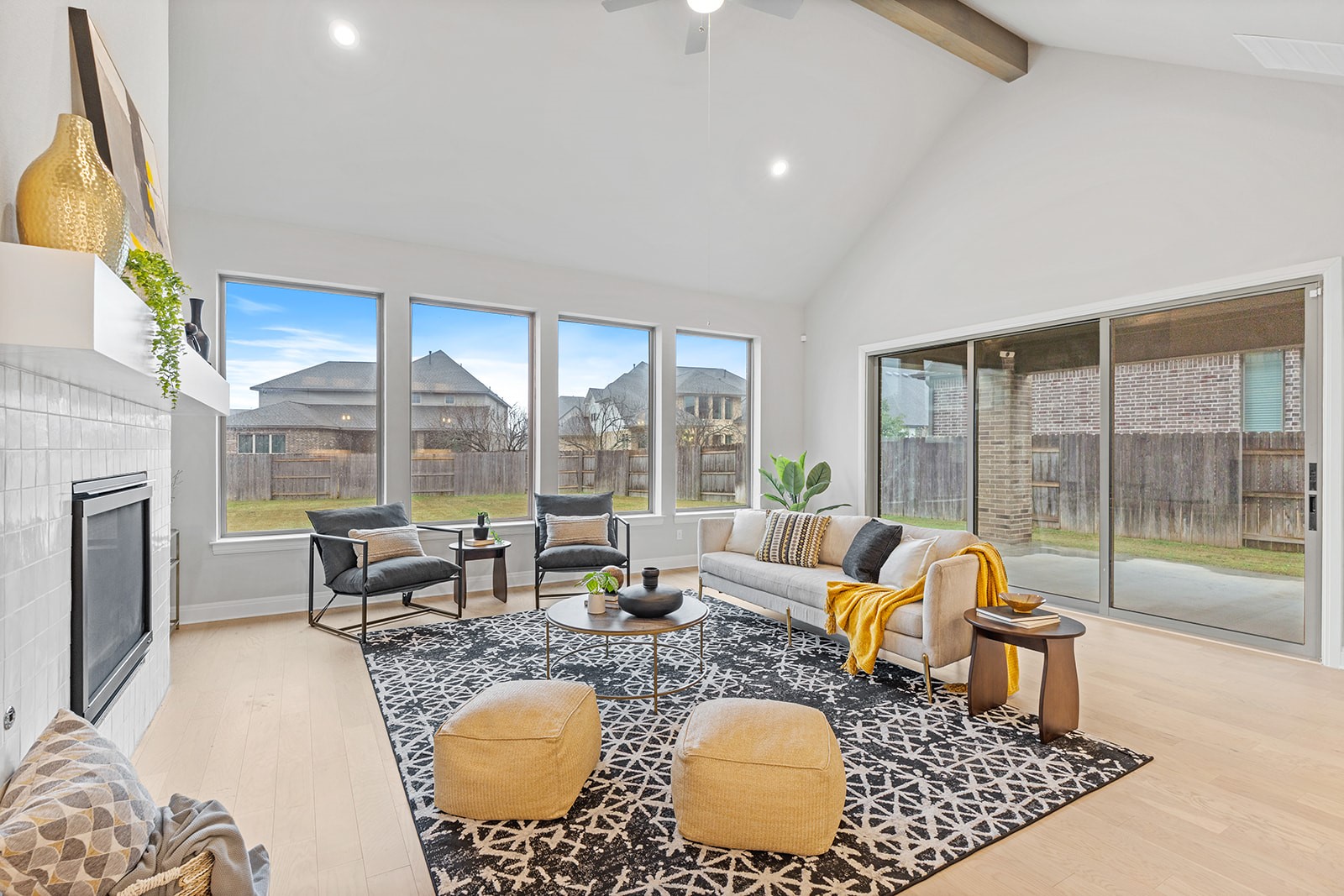 105 Bull Rdg Trail Georgetown, TX 78628 - Photo 4 of 36 a living room with fireplace furniture and a floor to ceiling window