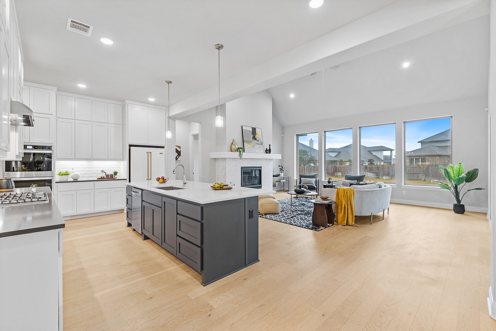 105 Bull Rdg Trail Georgetown, TX 78628 - Photo 10 of 36 a kitchen with kitchen island and white cabinets