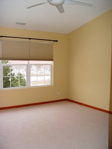 24136 Walnut Circle Plainfield, IL 60585 - Photo 15 of 17 an empty room with a window