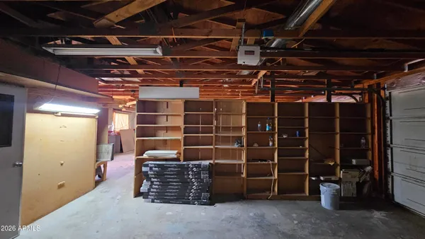 a view of an empty room with storage