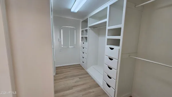 a view of an empty walk in closet