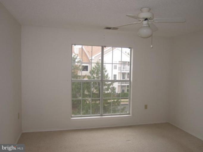 20963 Timber Ridge Terrace, Unit 303 Ashburn, VA 20147 - Photo 6 of 8 Bedroom #1
