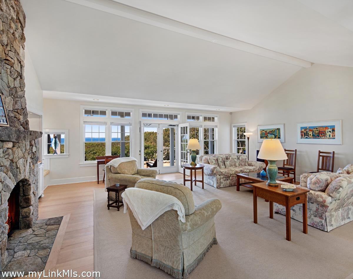 78 Hammett Road Chilmark, MA 02535 - Photo 18 of 53 a living room with furniture and a fireplace