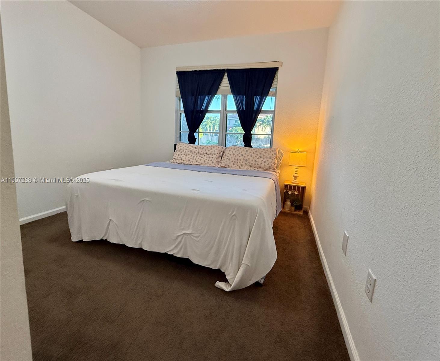 1740 Northwest 21st Street Homestead, FL 33030 - Photo 15 of 23 a bedroom with a bed and window