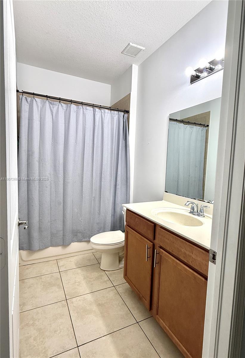 1740 Northwest 21st Street Homestead, FL 33030 - Photo 17 of 23 a bathroom with a sink a toilet and shower