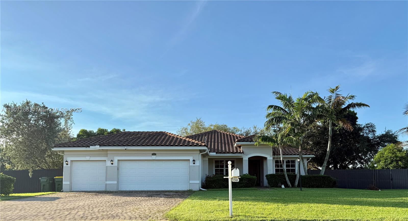 1740 Northwest 21st Street Homestead, FL 33030 - Photo 2 of 23 a front view of a house with garden