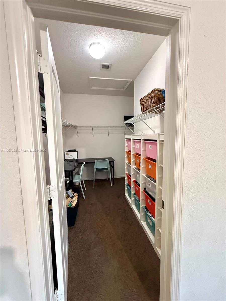 1740 Northwest 21st Street Homestead, FL 33030 - Photo 21 of 23 a room with furniture and white walls