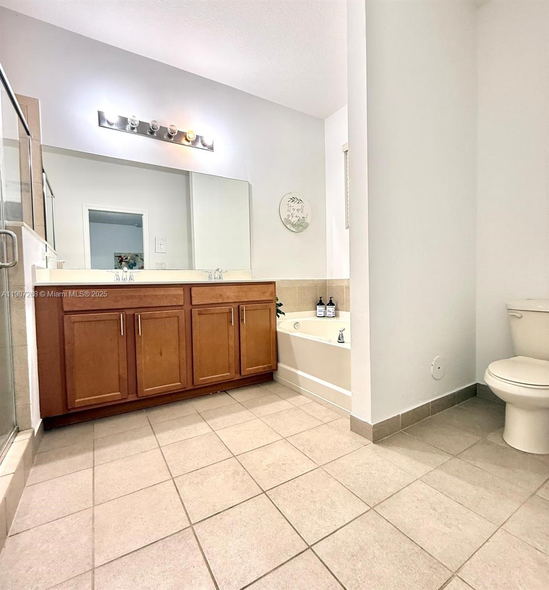 1740 Northwest 21st Street Homestead, FL 33030 - Photo 23 of 23 a large bathroom with a tub sink and mirror