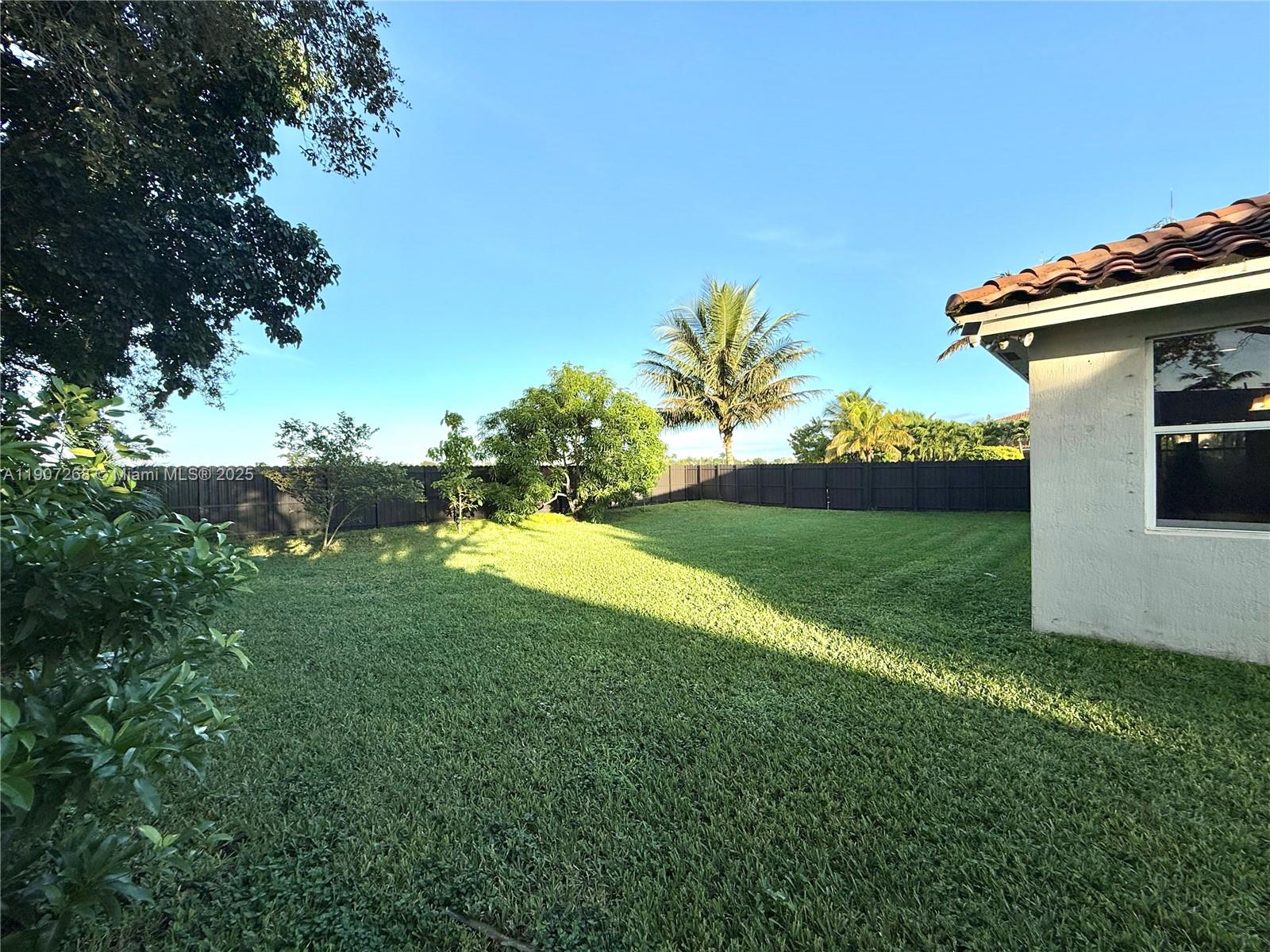 1740 Northwest 21st Street Homestead, FL 33030 - Photo 5 of 23 a view of a house with a backyard