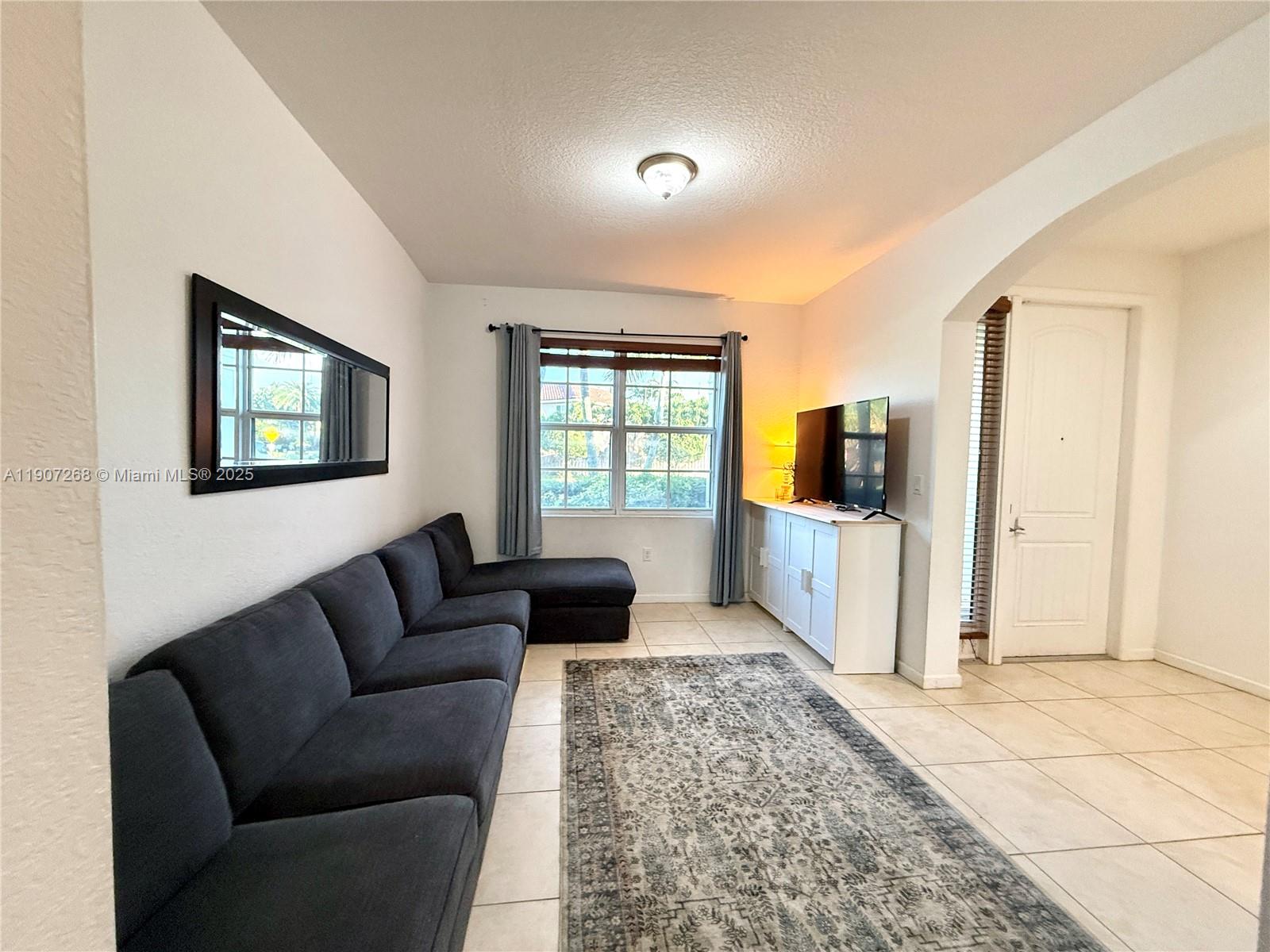 1740 Northwest 21st Street Homestead, FL 33030 - Photo 7 of 23 a living room with furniture and windows