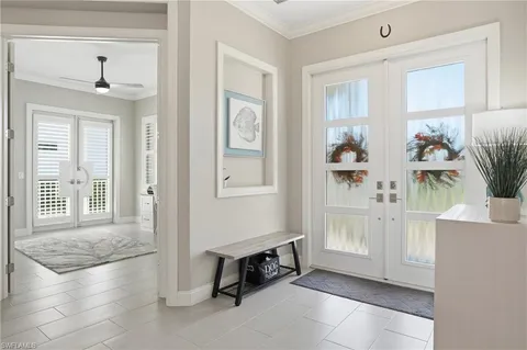 a spacious bedroom with a bed and a window