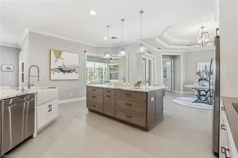 a spacious bathroom with a double vanity sink a mirror a bathtub and shower