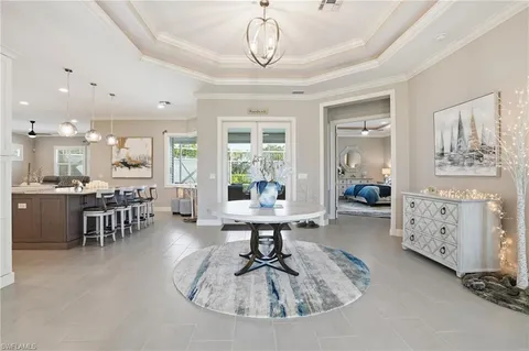 a living room with furniture a table and chairs