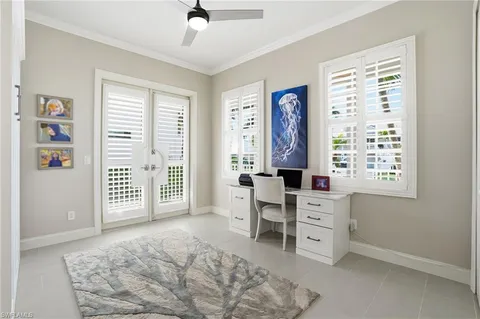 a view of a bedroom with a window and furniture