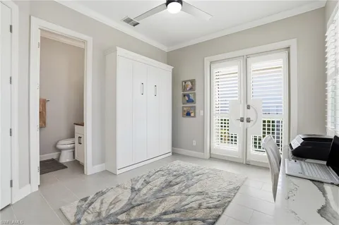 a view of a bedroom with a hardwood floor and a bathroom