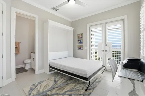 a spacious bedroom with a bed and a couch