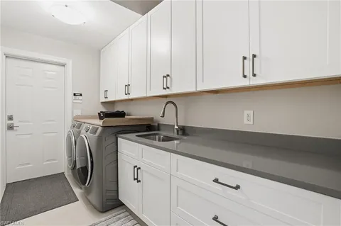 a kitchen with a sink and cabinets