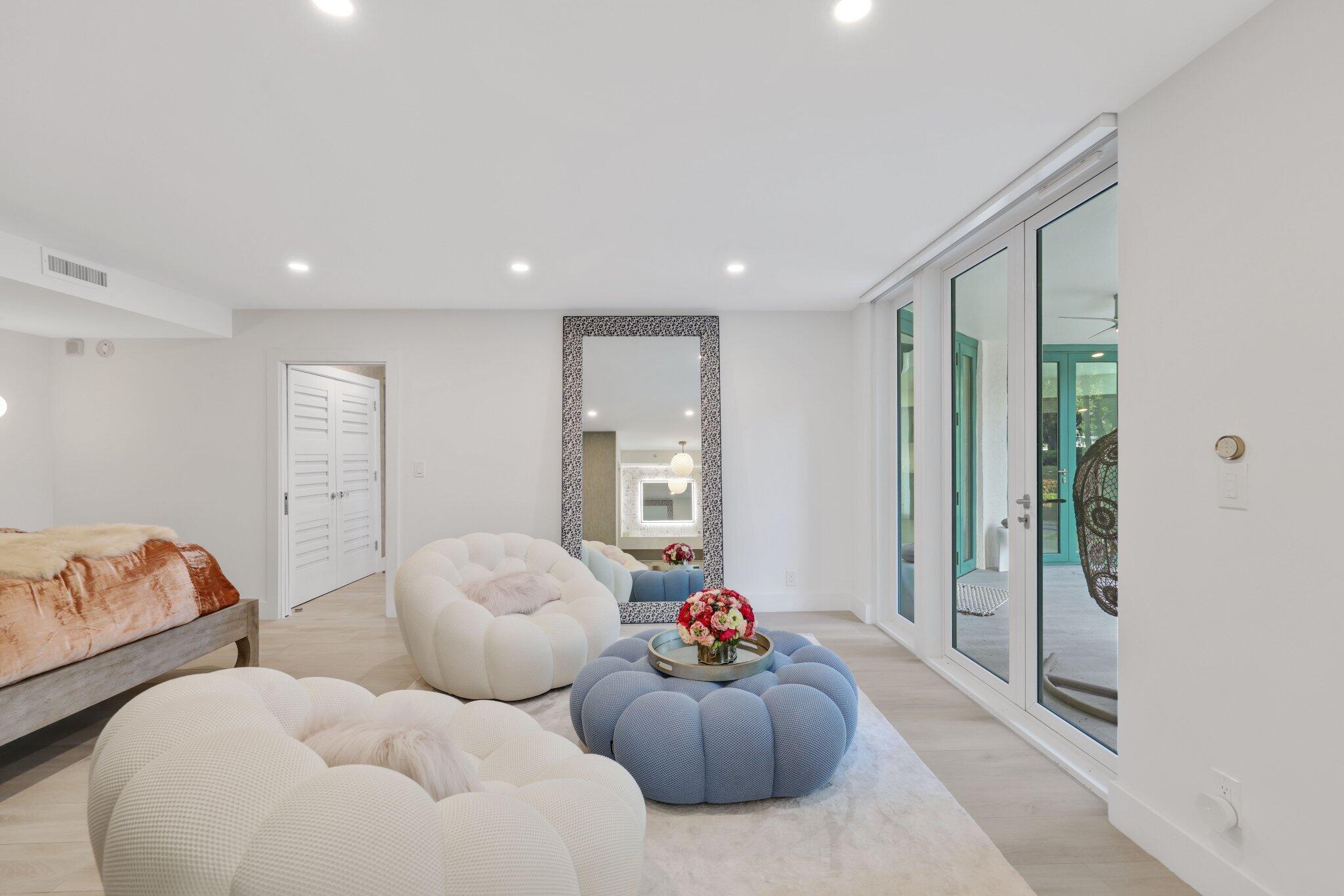 100 Southeast 5th Avenue, Unit 106 Boca Raton, FL 33432 - Photo 25 of 81 a living room with furniture and a large window