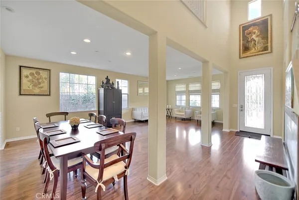 a view of dining room with furniture and wooden floor